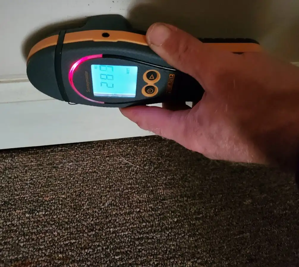 Moisture detection at baseboard during Storm Damage Restoration in Salem